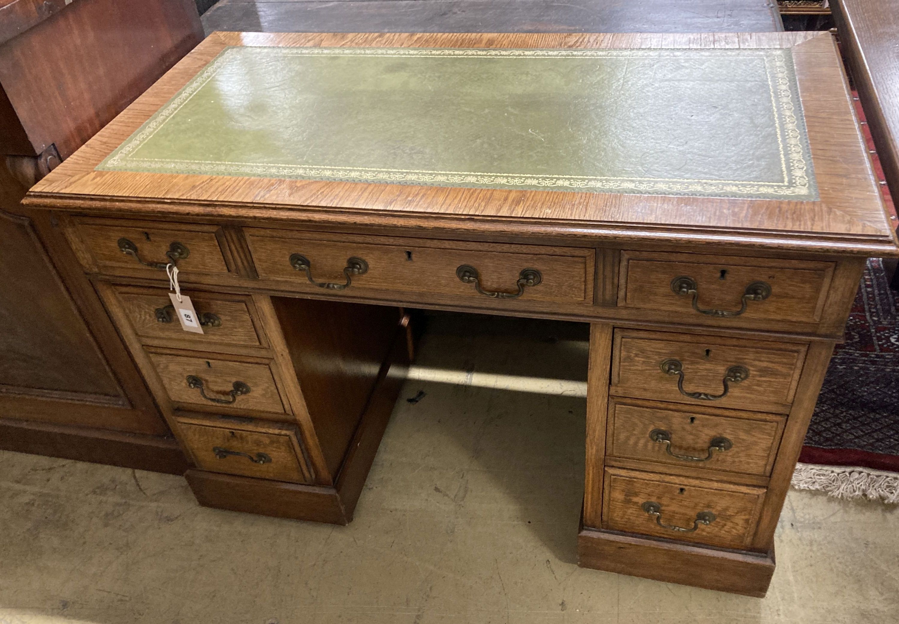 A small Victorian style oak pedestal desk, width 107cm, depth 57cm, height 76cm